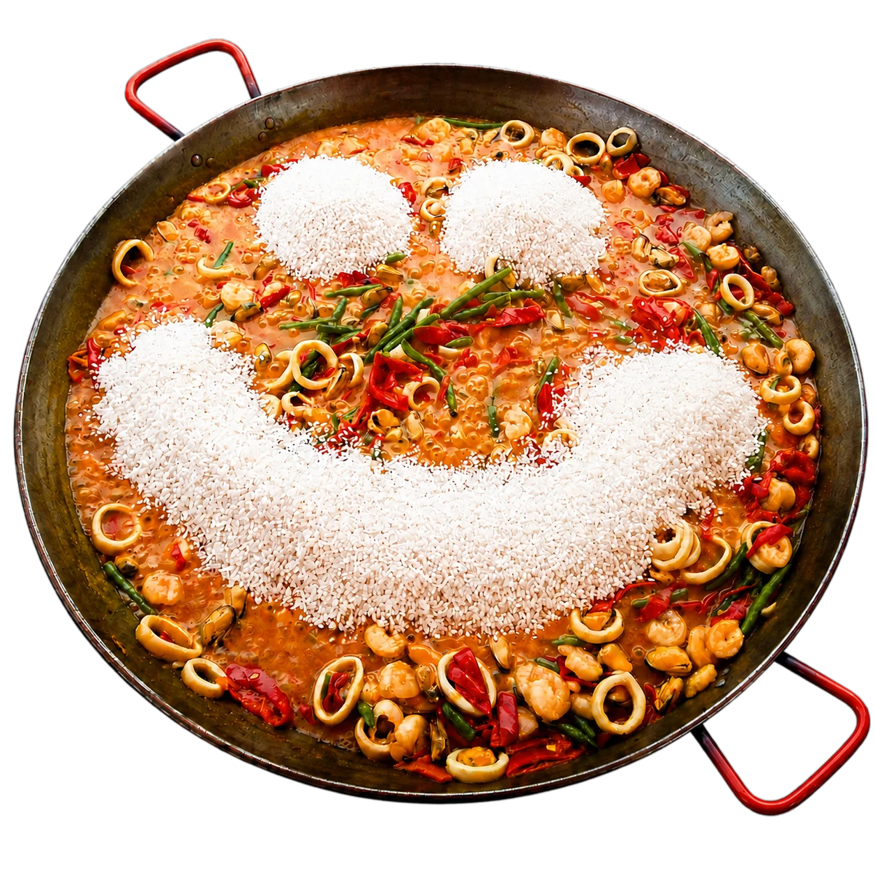 Paellera de marisco con una sonrisa dibujada con arroz